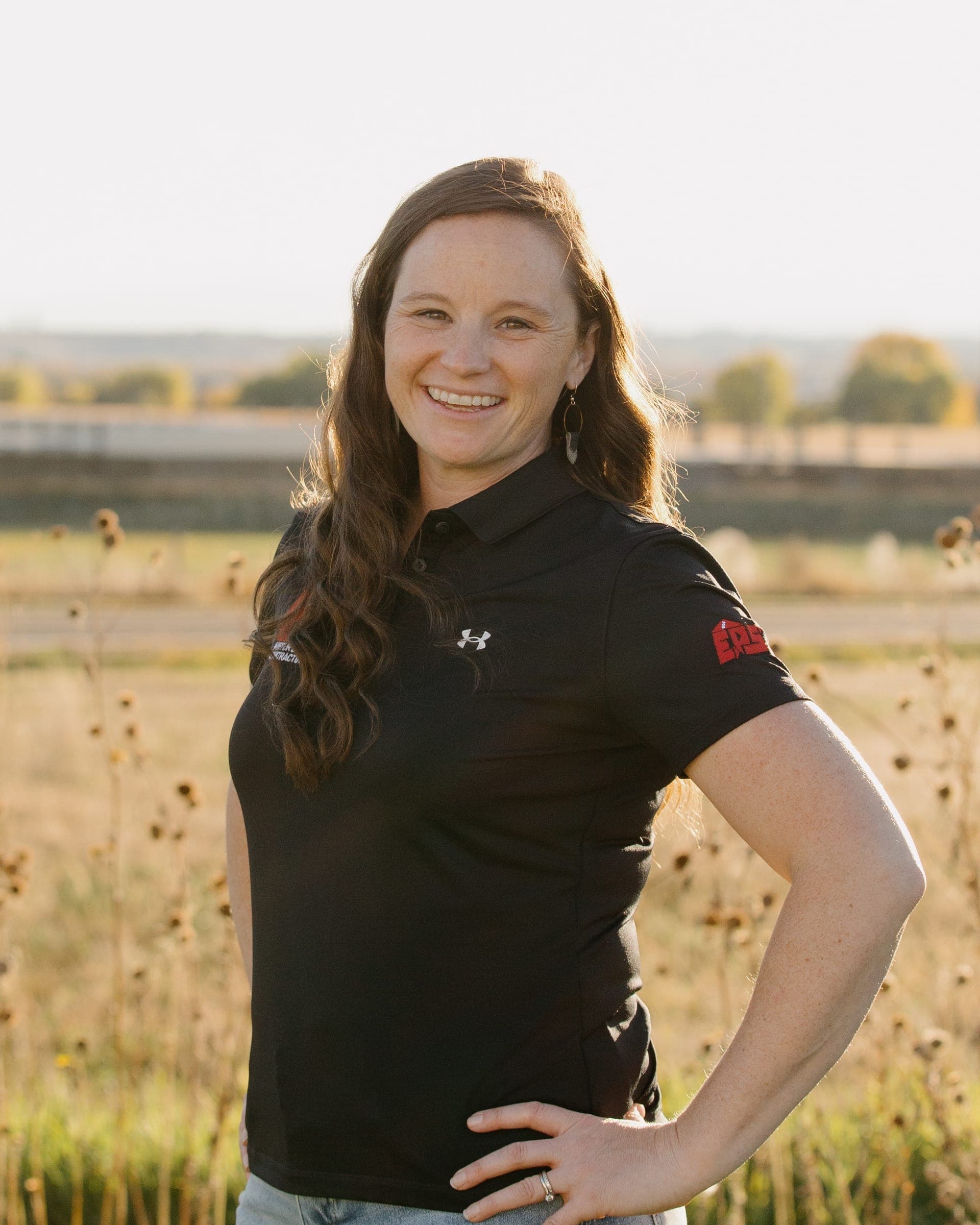 Marlys Kiefer wearing a Kiefer Built shirt outdoors