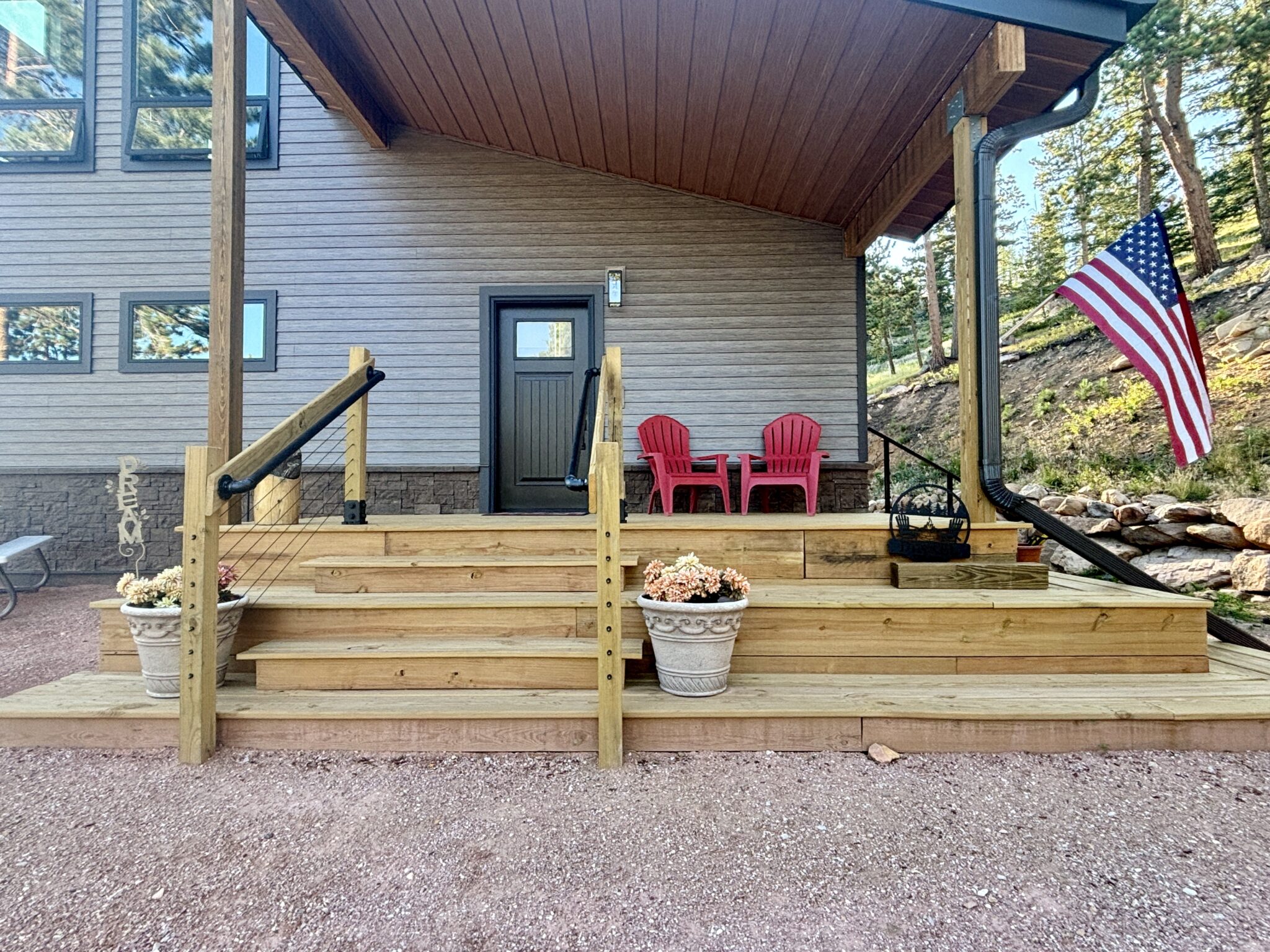 Outdoor stairs leading to the entry way of a new home built by Kiefer Built Contracting.