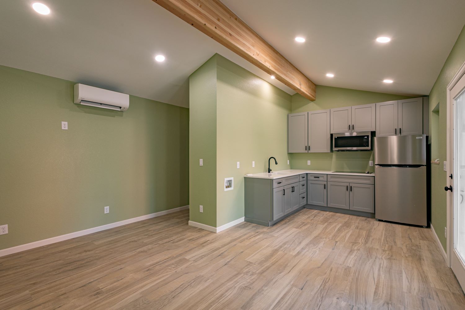 Efficient new build with optimized space, ample storage, hardwood floors, and a beautiful kitchen.