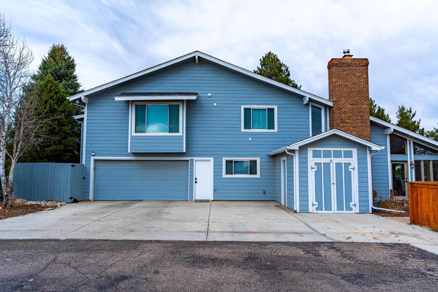 Renovated 1960s blue and white home, enhancing functionality, elegance, and value with modern updates.